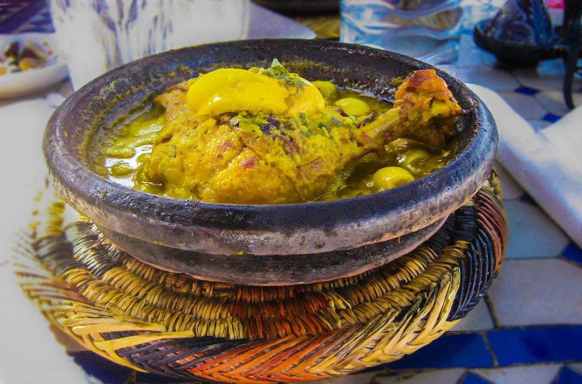 Traditional Moroccan tagine with vegetables served in a clay dish